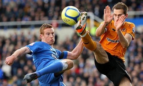 Roger Johnson challenges for the ball with Adam Rooney