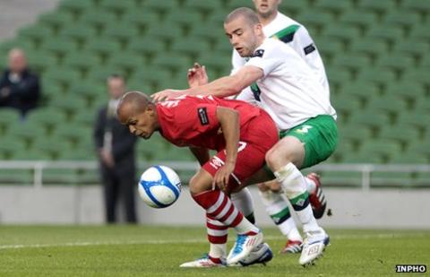 Wales striker Robert Earnshaw battles with Northern Ireland's Colin Coates last May
