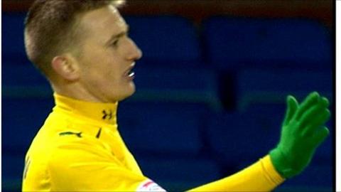 Derek Riordan scores against Kilmarnock.