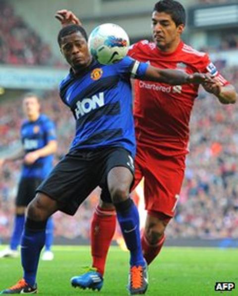Patrice Evra (left) and Luis Suarez