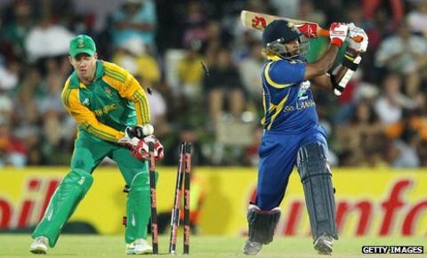 Sri Lanka's Lasith Malinga is bowled, watched by South Africa captain AB de Villiers