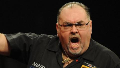Tony O'Shea celebrates beating BDO world champion Martin Adams
