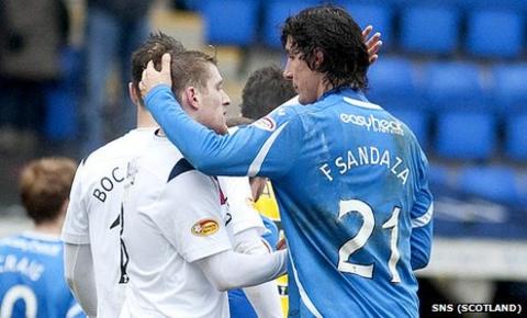 Francisco Sandaza shares an embrace with Rangers captain Steven Davis