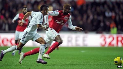 Arsenal's defender Johan Djourou and Swansea City's Scott Sinclair