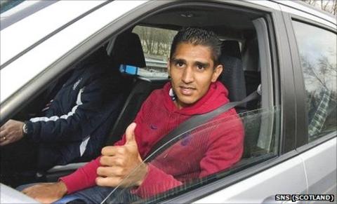 Jorge Claros is whisked away from Glasgow Airport