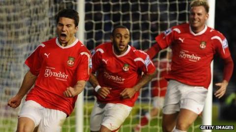 Cieslewicz (left) celebrates after scoring Wrexham's equaliser at Brighton