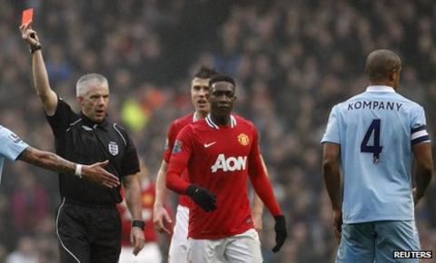 Vincent Kompany and Chris Foy