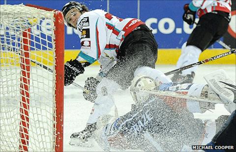 Darryl Lloyd of the Belfast Giants has his shot saved by Edinburgh netminder Nathan Craze