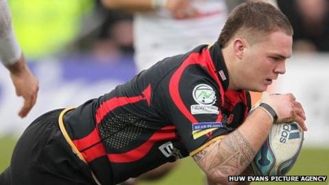 Rhys Buckley goes over for the Dragons