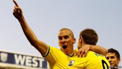 Steve Morison celebrates his winning goal for Norwich City at West Brom with Grant Holt