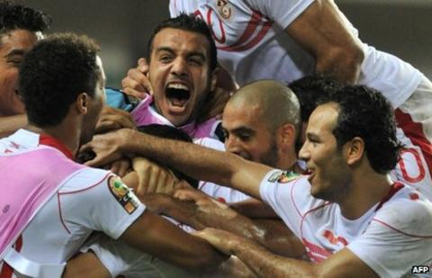 Tunisian players celebrate their victory over Morocco
