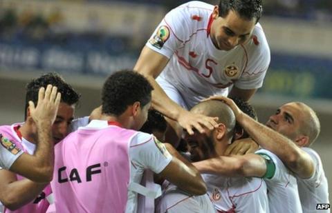Tunisia players celebrate their 2-1 win over Morocco