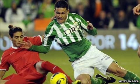 Jorge Molina is dispossessed by Martin Caceres of Savilla