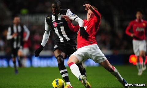 Demba Ba, left, takes on Phil Jones