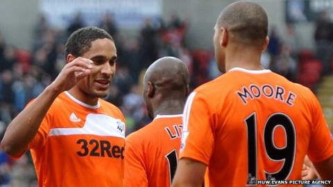 Ashley Williams celebrates with Luke Moore after the striker had put Swansea ahead against Bolton Wanderers