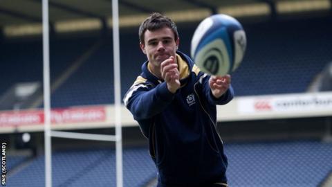 Scotland winger Lee Jones warming up at Murrayfield