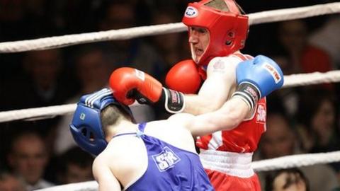 Hugh Myers is on the defensive as Paddy Barnes lands a punch