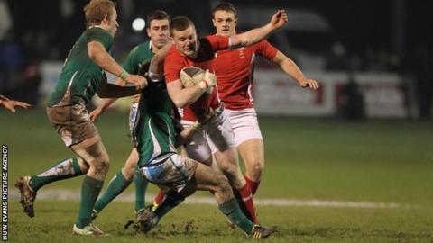 Wales' Iolo Evans is tackled by Kieron Marmion of Ireland