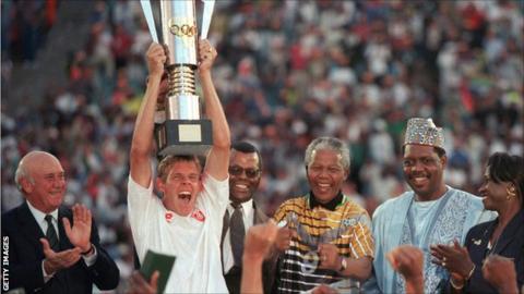 South Africa's winning captain of the 1996 Africa Cup of Nations Neil Tovey lifts the trophy in Johannesburg