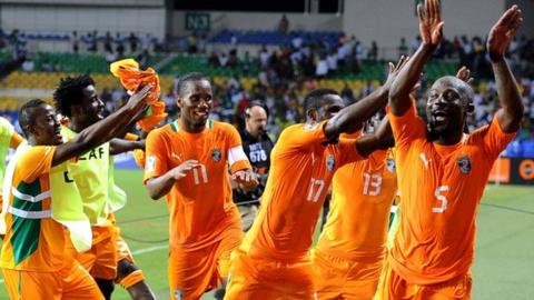 Ivory Coast players celebrate their win over Mali
