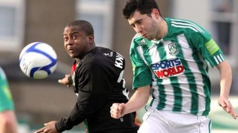 Leon Best challenges Dave Webster for the ball in the first leg at Bray