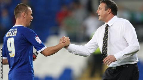 Malky Mackay shakes the hand of Cardiff striker Kenny Miller