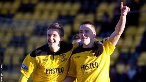 Bobby Barr (left) celebrates with Livingston's hat-trick scorer Marc McNulty