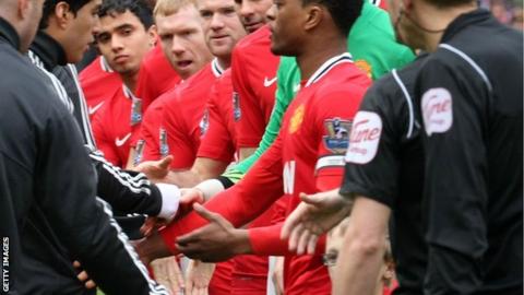 Luis Suarez refuses to shake Patrice Evra's hand