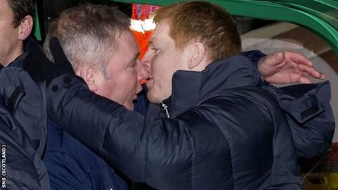 Celtic boss Neil Lennon shares an embrace with Rangers counterpart Ally McCoist (left)