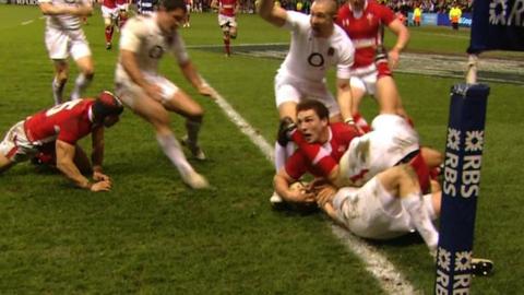 David Strettle's attempt to score a try is held up by George North