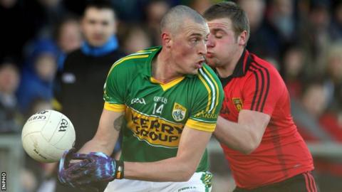 Kieran Donaghy is challenged by Arthur McConville at Pairc Esler