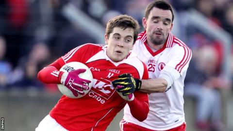 Ryan McMenamin challenges Louth's Andy McDowell at Drogheda