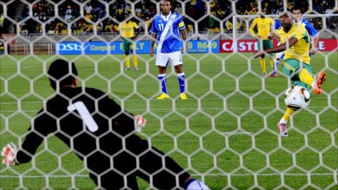 Katlego Mphela scores one of three penalties awarded in South Africa's 5-0 win over Guatemala