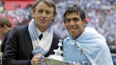 Roberto Mancini and Carlos Tevez