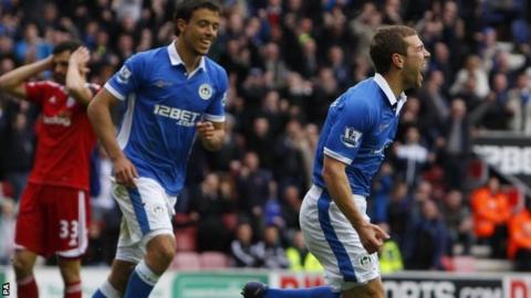 James McArthur celebrates scoring for Wigan