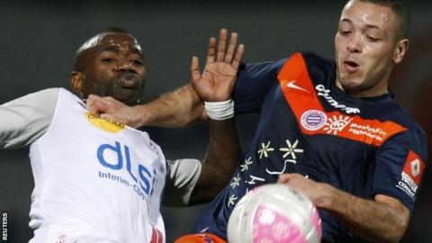 Jamel Saihi (R) challenges AS Nancy's Lossemy Karaboue (L) in a French Ligue 1 match on 17 March