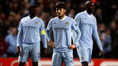David Silva (centre), Kolo Toure (left) and Yaya Toure look dejected