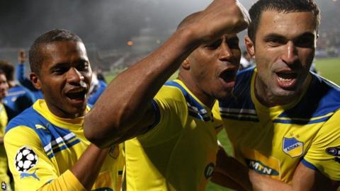 Apoel Nicosia players celebrate beating Lyon