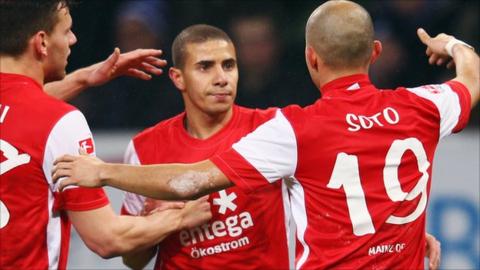 Zidan is congratulated after his goal against