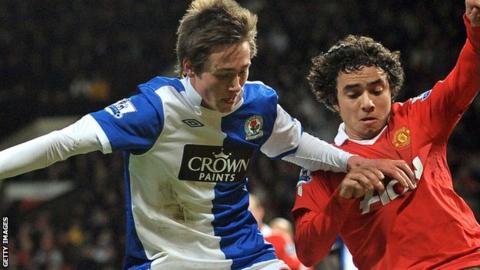 Josh Morris is tackled by Manchester United's Rafael Da Silva