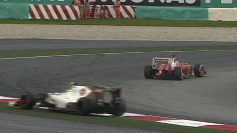 Sergio Perez runs wide