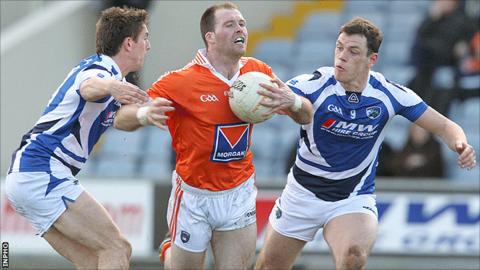 Armagh's Ciaran McKeever in action against Colm Begley and John O'Loughlin of Laois