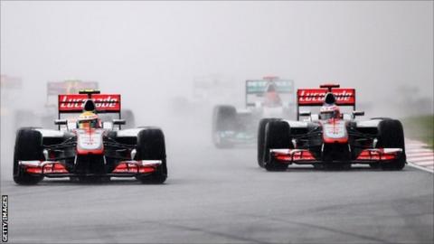 Lewis Hamilton (centre) of Great Britain, McLaren and Jenson Button (right) of Great Britain