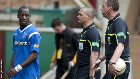 Aluko (left) has words with referee Brines (right) at half-time