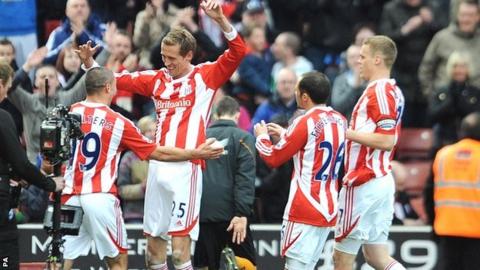Peter Crouch (second-left) is congratulated by team-mates
