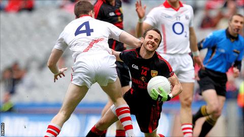 Cork's Eoin Cotter blocks the path of Down opponent Conor Laverty during the semi-final at Croke Park