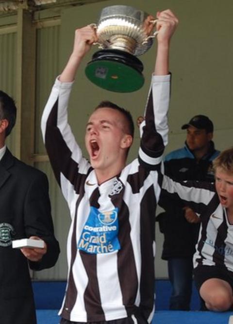 Mark McGrath lifts the Guernsey FA Cup