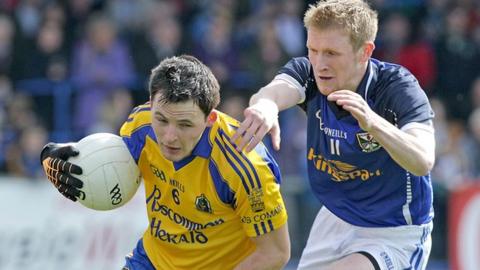 Roscommon's Paddy Broggan is challenged by Chris Conroy