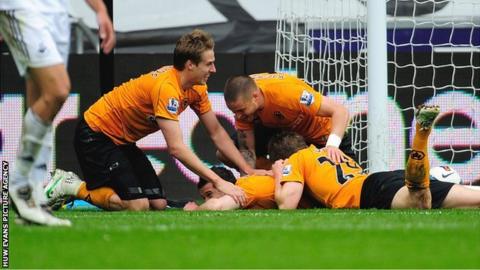 Goal-scorer Matt Jarvis is mobbed by his Wolves team-mates