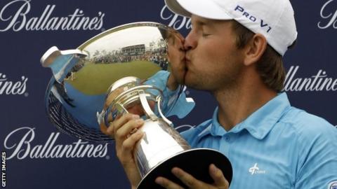 Austria's Bernd Wiesberger with the Ballantine's Championship trophy